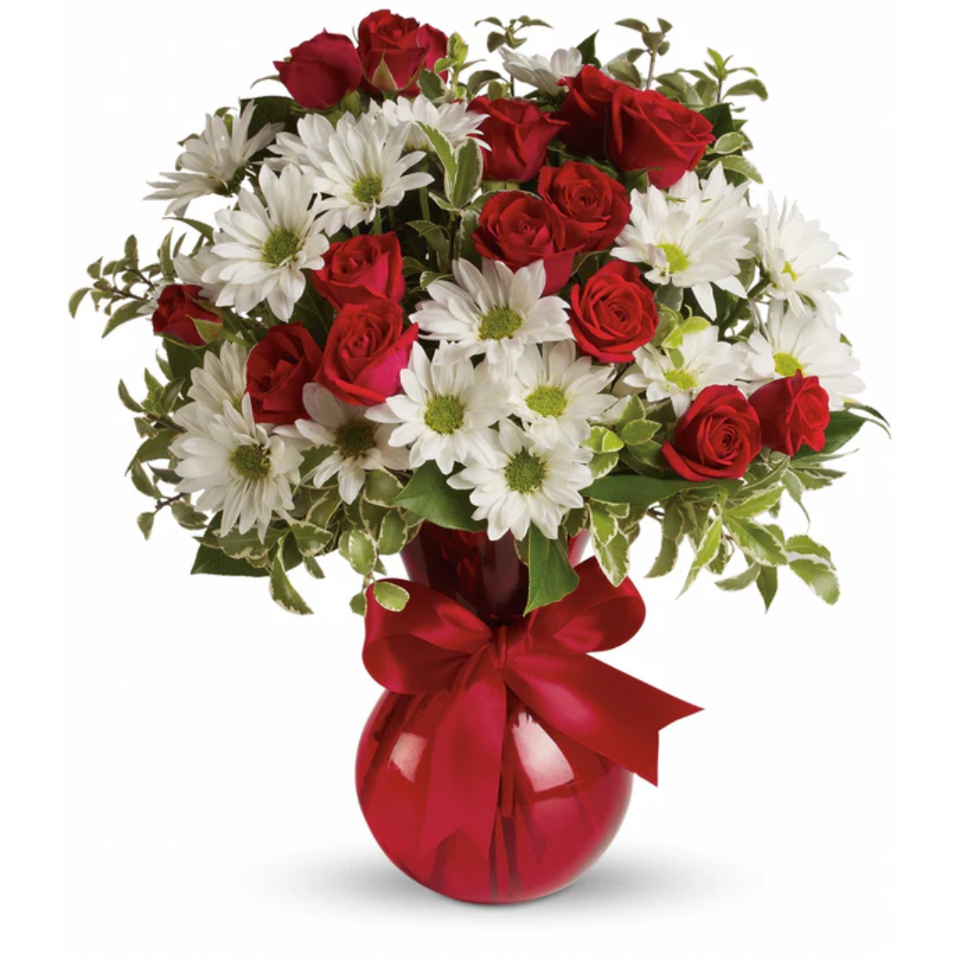 Red roses and white daisies bouquet in red vase.